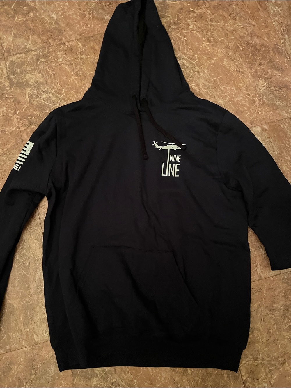 District Black Hoodie with White Helicopter Logo